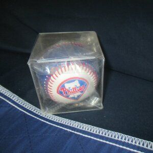 Baseball with a Phillies logo on it